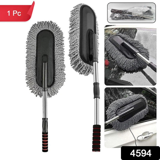 Hand using the soft Car Dust Brush to meticulously clean a car's dashboard without scratching surfaces.