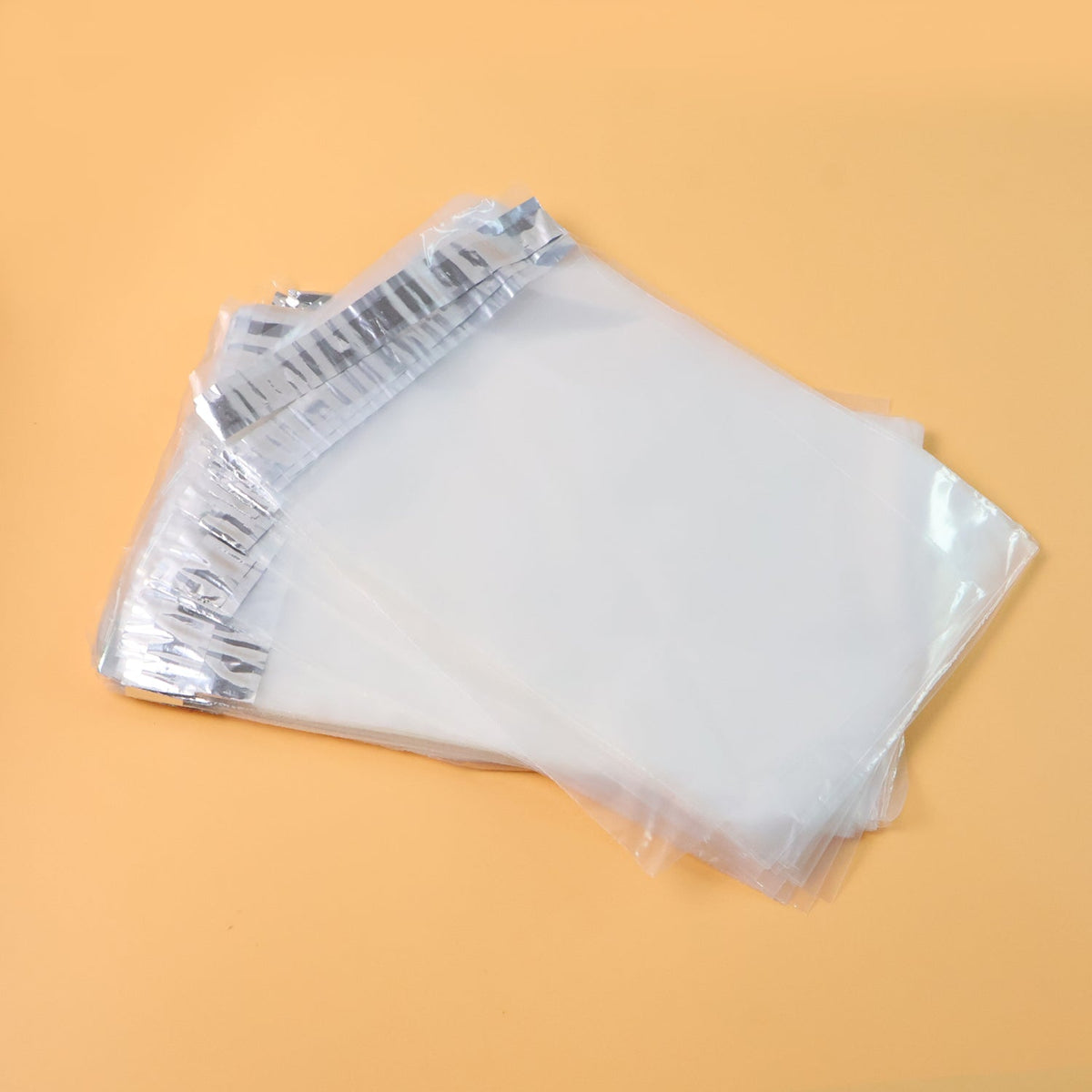 Pack of self-adhesive courier polybags 6.5x8 inch displaying waterproof tamper-proof packaging