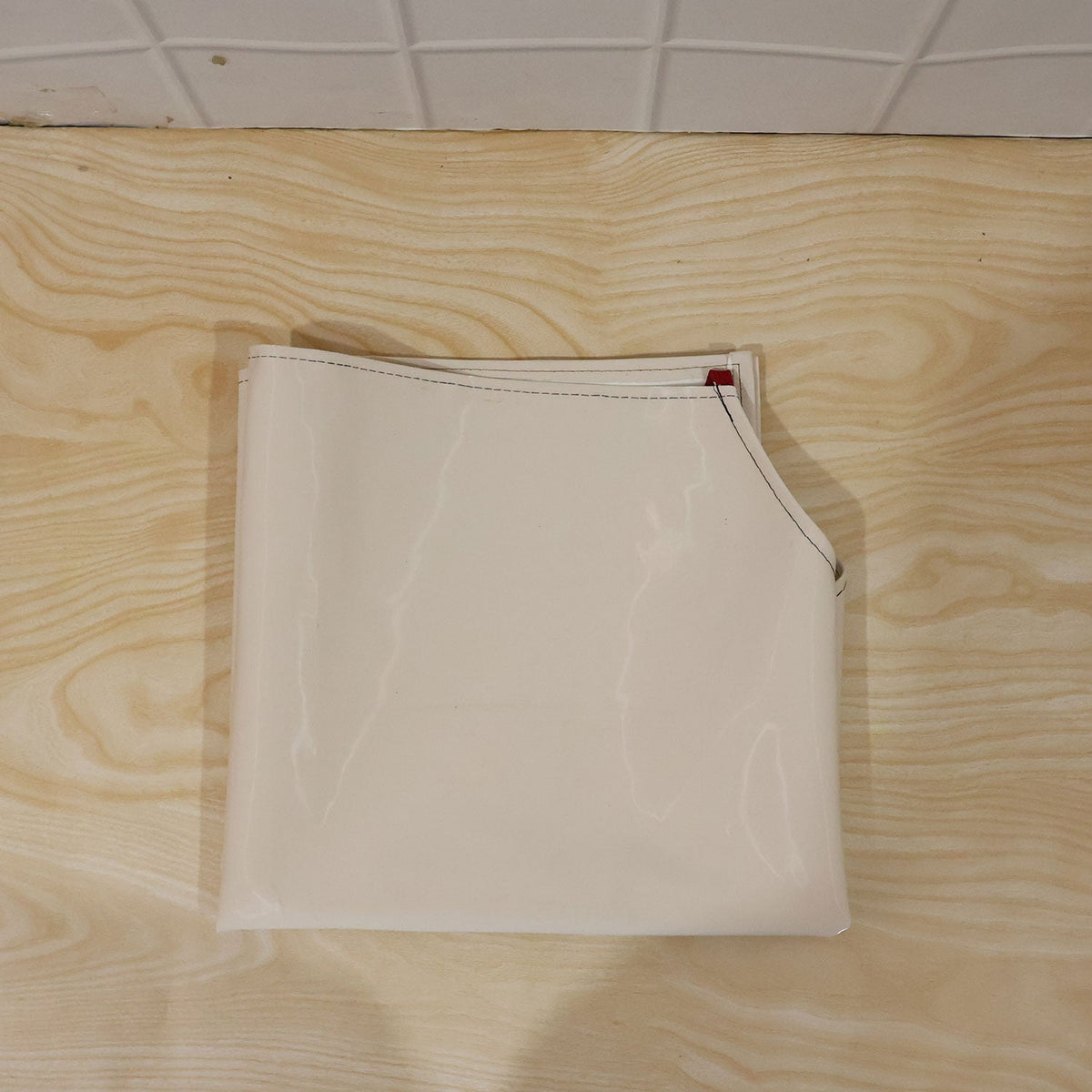 Person wearing waterproof apron while cooking in kitchen