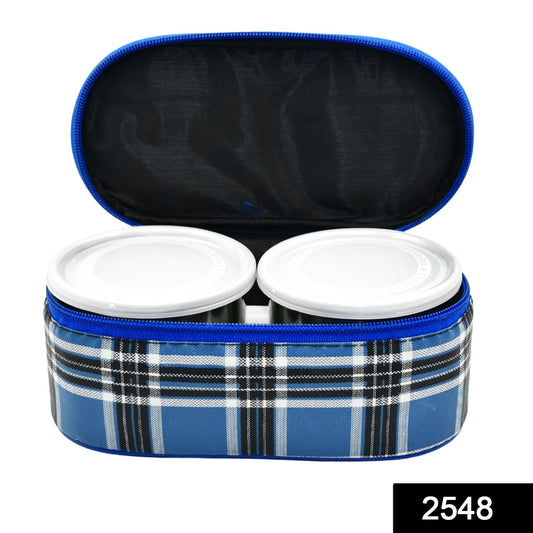 Three round stainless steel tiffin containers neatly stacked.