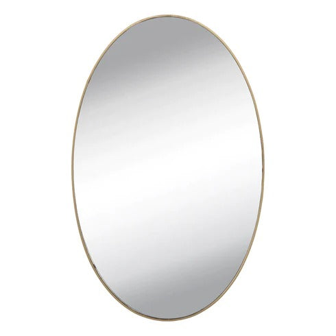 Installation view of an oval mirror wall sticker being applied to a smooth surface.
